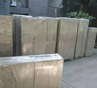 Furniture and cartons secured in multi-layer wrap
